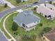 Aerial view of single-story house with landscaped yard at 27504 Stoney Brook Dr, Leesburg, FL 34748
