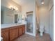Well-appointed bathroom with walk-in shower and double vanity at 27504 Stoney Brook Dr, Leesburg, FL 34748