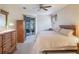 Spacious bedroom with ample closet space and sliding glass doors to the patio at 27504 Stoney Brook Dr, Leesburg, FL 34748