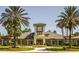 Inviting community center with clock tower and landscaping at 27504 Stoney Brook Dr, Leesburg, FL 34748