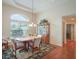 Dining room with hardwood floors, a wooden table, and a china cabinet at 27504 Stoney Brook Dr, Leesburg, FL 34748