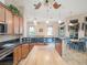 Kitchen with large island, granite counters, and view to dining area at 27504 Stoney Brook Dr, Leesburg, FL 34748