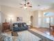 Living room with hardwood floors, a ceiling fan, and comfortable seating at 27504 Stoney Brook Dr, Leesburg, FL 34748
