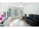 Spacious living room with bay window and hardwood floors at 3074 Salerno Ln, The Villages, FL 32163