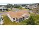 Aerial view showing house, screened porch, and surrounding neighborhood at 3200 Woodridge Dr, The Villages, FL 32162
