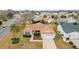 Single-story house with a driveway and yard, seen from above at 3200 Woodridge Dr, The Villages, FL 32162
