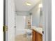 Clean bathroom with shower/tub combo and wood vanity at 3200 Woodridge Dr, The Villages, FL 32162