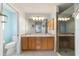 Bathroom featuring double vanity, shower, and toilet at 3200 Woodridge Dr, The Villages, FL 32162