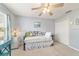 Bedroom with daybed, ceiling fan, and double door closet at 3200 Woodridge Dr, The Villages, FL 32162