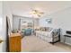Cozy bedroom with daybed, window, and ceiling fan at 3200 Woodridge Dr, The Villages, FL 32162