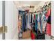 Well-organized closet with hanging rods and shelving at 3200 Woodridge Dr, The Villages, FL 32162