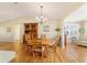 Bright dining area with hardwood floors and wood furniture at 3200 Woodridge Dr, The Villages, FL 32162