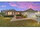 Attractive single-story home with landscaped yard and two-car garage at 3200 Woodridge Dr, The Villages, FL 32162