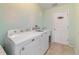 Laundry room with front load washer and dryer at 3200 Woodridge Dr, The Villages, FL 32162