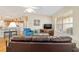 Living area showcasing hardwood floors and access to the kitchen at 3200 Woodridge Dr, The Villages, FL 32162