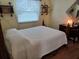 Guest bedroom with full-size bed and wood flooring at 32218 Sweet Briar Court, Leesburg, FL 34748