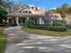 Community building with welcoming front porch and landscaping at 32218 Sweet Briar Court, Leesburg, FL 34748