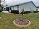 Rear view of house showing additional windows and patio at 32218 Sweet Briar Court, Leesburg, FL 34748