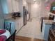 Open concept kitchen featuring white cabinets and tile flooring at 32218 Sweet Briar Court, Leesburg, FL 34748