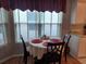 Cozy kitchen nook with table and chairs, perfect for casual dining at 32218 Sweet Briar Court, Leesburg, FL 34748