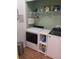 Laundry room with washer, dryer, and ample storage shelving at 32218 Sweet Briar Court, Leesburg, FL 34748
