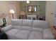 Living area featuring light colored sofas and two armchairs at 32218 Sweet Briar Court, Leesburg, FL 34748