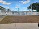 Community swimming pool with white fence and no lifeguard on duty at 32218 Sweet Briar Court, Leesburg, FL 34748
