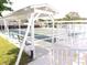 Covered shuffleboard courts with seating and shaded areas at 32218 Sweet Briar Court, Leesburg, FL 34748