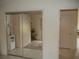 Mirrored closet doors and bedroom view at 3243 Mansfield St, The Villages, FL 32162