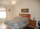 Spacious bedroom with a large bed and ample light at 3243 Mansfield St, The Villages, FL 32162