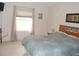 Bright bedroom with wood furniture and tiled floors at 3243 Mansfield St, The Villages, FL 32162