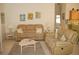 Living room with neutral colored couches and coffee table at 3243 Mansfield St, The Villages, FL 32162