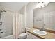 Bathroom with toilet, vanity, and shower/tub combo at 3347 Empire Ave, The Villages, FL 32163