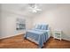 Bright bedroom with hardwood floors and a window at 3347 Empire Ave, The Villages, FL 32163