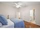 Comfortable bedroom with hardwood floors and ensuite bathroom at 3347 Empire Ave, The Villages, FL 32163