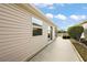 Side view showing exterior and walkway at 3347 Empire Ave, The Villages, FL 32163