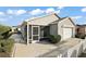 Exterior view showcasing screened patio and garage at 3347 Empire Ave, The Villages, FL 32163