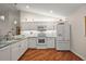 Modern kitchen with white cabinets and stainless steel appliances at 3347 Empire Ave, The Villages, FL 32163