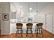 Kitchen island with seating for three at 3347 Empire Ave, The Villages, FL 32163