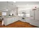 Modern kitchen featuring white cabinets and stainless steel appliances at 3347 Empire Ave, The Villages, FL 32163