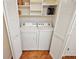 Convenient laundry room with washer and dryer in a closet at 3347 Empire Ave, The Villages, FL 32163