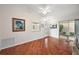 Living room with hardwood floors, access to patio, and ceiling fan at 3347 Empire Ave, The Villages, FL 32163
