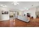 Living room with hardwood floors, access to patio, and ceiling fan at 3347 Empire Ave, The Villages, FL 32163