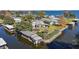 Waterfront property with private boat dock and lush landscaping at 34205 Island Dr, Leesburg, FL 34788