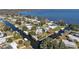 Aerial view of canal front community with lush green spaces at 34205 Island Dr, Leesburg, FL 34788