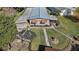 Single-story home with landscaped yard and fountain at 34205 Island Dr, Leesburg, FL 34788