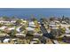 Aerial view of waterfront community with homes and boat docks at 34205 Island Dr, Leesburg, FL 34788