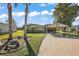 Single story home with carport and landscaped yard at 34205 Island Dr, Leesburg, FL 34788