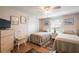 Two twin beds, dresser, and ceiling fan in a guest bedroom at 34205 Island Dr, Leesburg, FL 34788