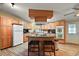 Island kitchen with wood cabinets, granite countertops, and stainless steel appliances at 34205 Island Dr, Leesburg, FL 34788